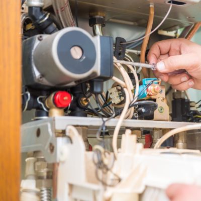 Technician repairing Gas Furnace